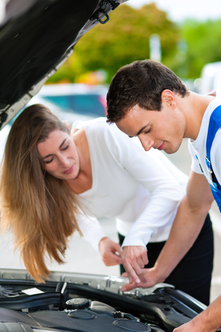 http://www.dreamstime.com/royalty-free-stock-photo-woman-talking-to-car-mechanic-repair-shop-image18353135