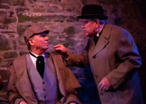 Sherlock Holmes (Peter J. Hill) gets a reality check from Dr. Watson (Bruce Heskett)