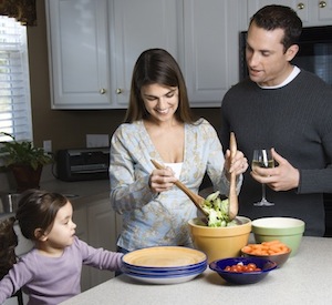 Family in kitchen.