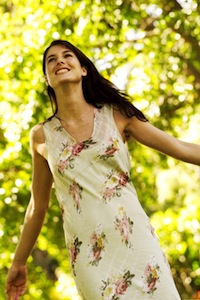 Young Woman Standing with Arms Stretched Out