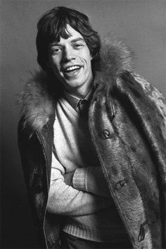 Mick Jagger joins in wearing this fur coat in a photoshoot