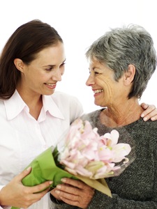 Mother and Daughter Holding a Bouquet of Flowers