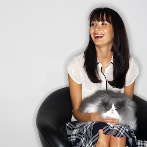 Woman Sitting with a Cat in Her Lap