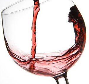 Wine being poured into a glass