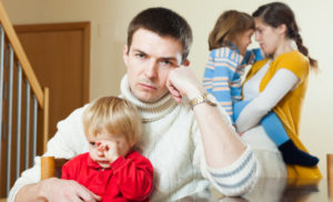 Young family conflict. Upset man against sadness woman at home