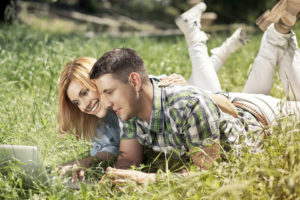 couple sitting in grass
