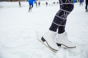 Female legs in ice skates