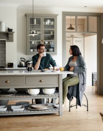 couple talking about values and goals before decluttering home