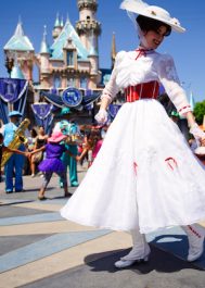 Anaheim, CA - August 10th 2016: Mary Poppins smiles at a young child as she leads a line of children in song and dance in front of Cinderella's castle during Disney's 60th Diamond Celebration.