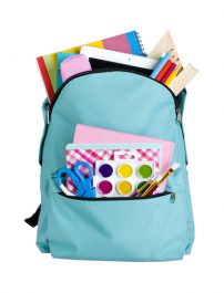 Blue school bag with school supplies isolated on white background