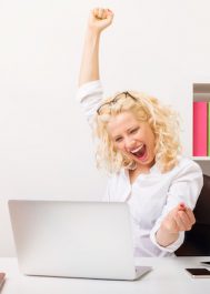 Beuatifull woman at the office celebrating her success